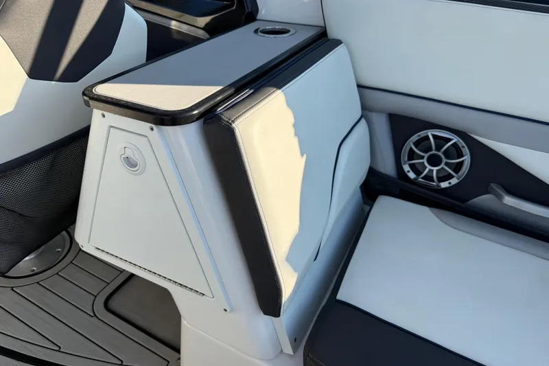 Slide: The Image of 2021 Yamaha Boats 252S interior seating with speaker and storage compartment. - 25