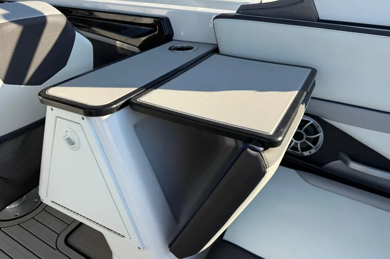 Slide: The Image of 2021 Yamaha Boats 252S interior with sleek seating and integrated speaker system. - 27