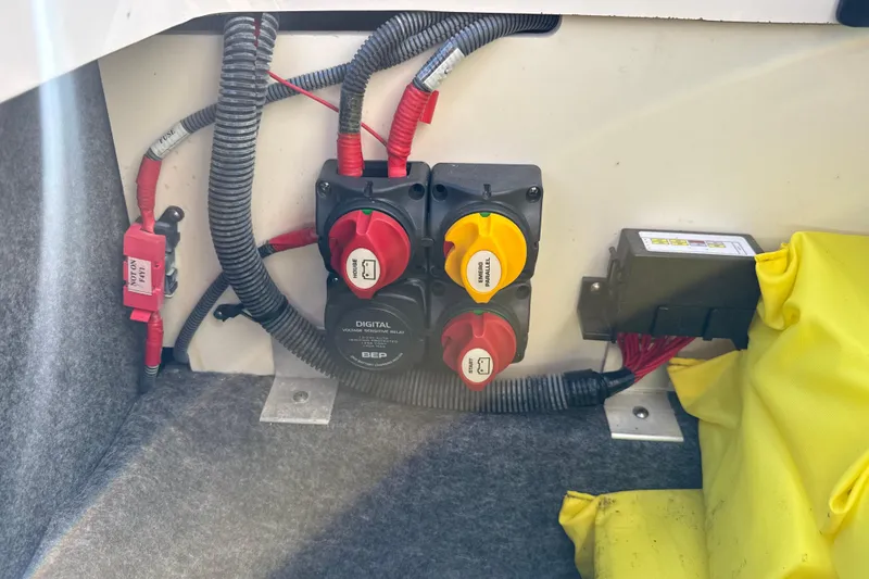 Slide: The Image of Electrical panel of a 2021 Yamaha Boats 252S with wiring and switches. - 30