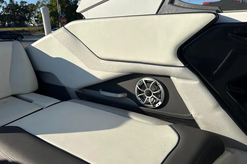 Slide: The Image of 2021 Yamaha Boats 252S interior with speaker and cushioned seating. - 31