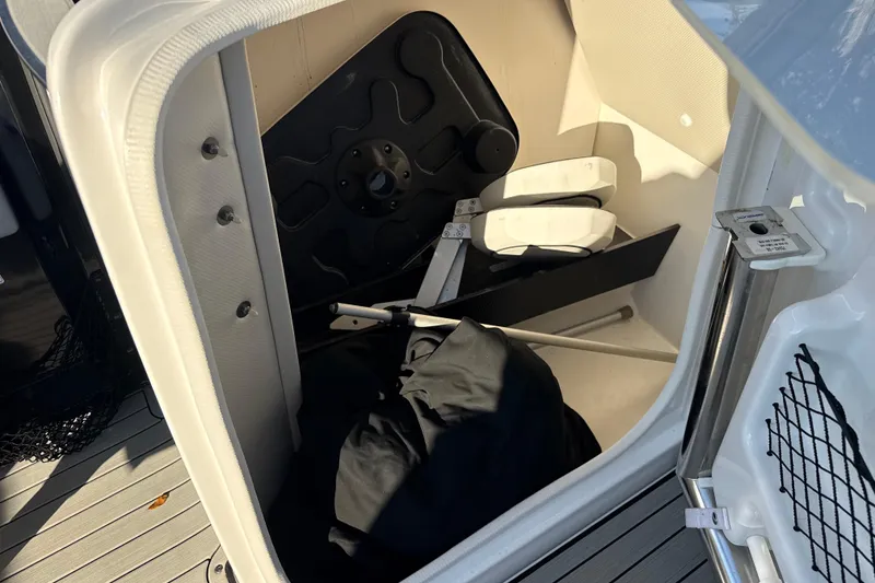 Slide: The Image of Storage compartment of 2021 Yamaha Boats 252S, featuring equipment and accessories. - 37