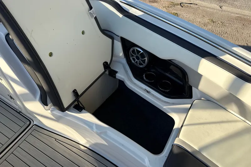 Slide: The Image of 2021 Yamaha Boats 252S interior with storage compartment and speaker detail. - 44