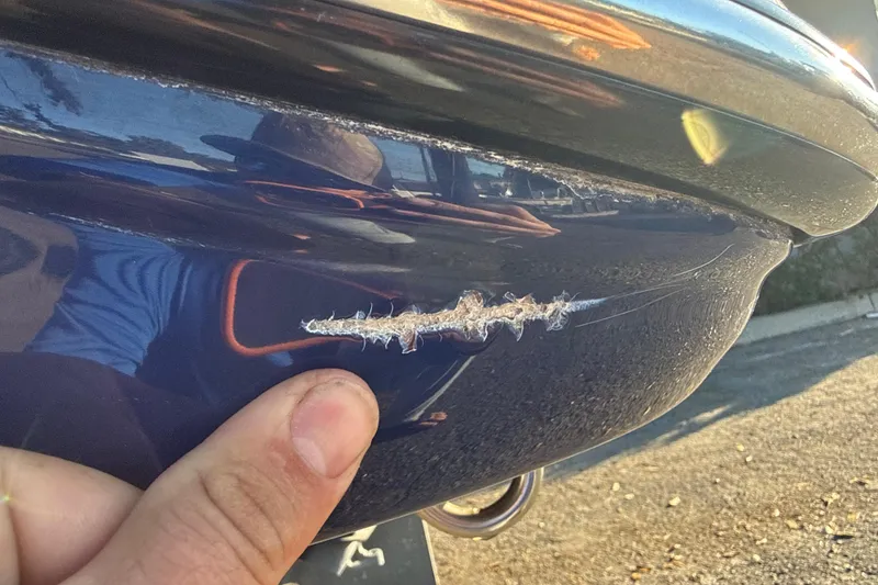 Slide: The Image of Scratch on 2021 Yamaha Boats 252S hull, close-up view. - 8