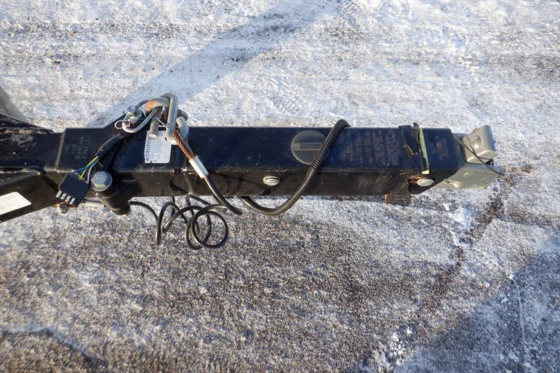 Slide: The Image of Trailer hitch of a 2013 Hurricane SunDeck 2400 IO on snowy ground. - 19