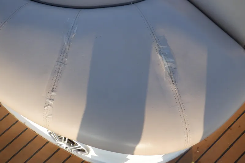 Slide: The Image of Damaged seat upholstery on 2013 Hurricane SunDeck 2400 IO boat. - 21