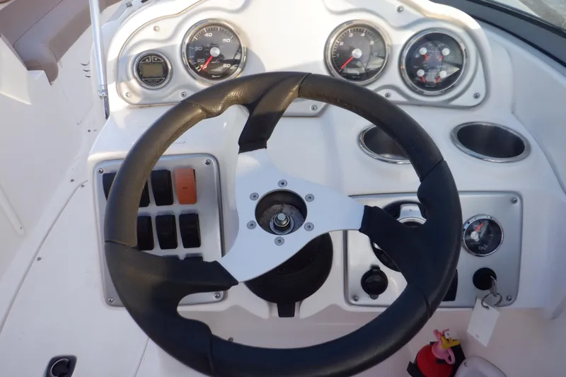 Slide: The Image of Steering wheel and dashboard of 2013 Hurricane SunDeck 2400 IO boat. - 31