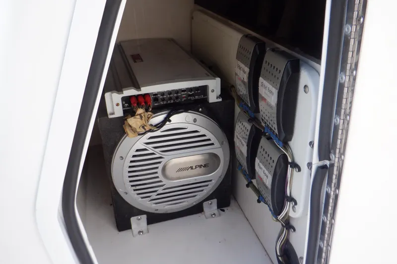 Slide: The Image of 2013 Hurricane SunDeck 2400 IO audio system with Alpine subwoofer and amplifiers. - 38