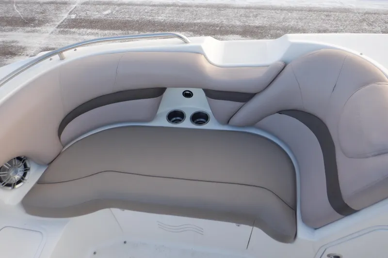 Slide: The Image of 2013 Hurricane SunDeck 2400 IO boat interior with cushioned seating and cup holders. - 39