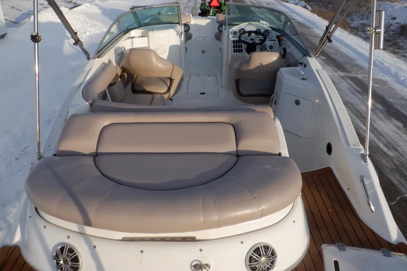 Slide: The Image of 2013 Hurricane SunDeck 2400 IO boat interior with seating and steering wheel. - 4