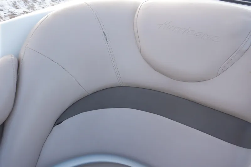 Slide: The Image of 2013 Hurricane SunDeck 2400 IO boat seat with beige upholstery. - 40