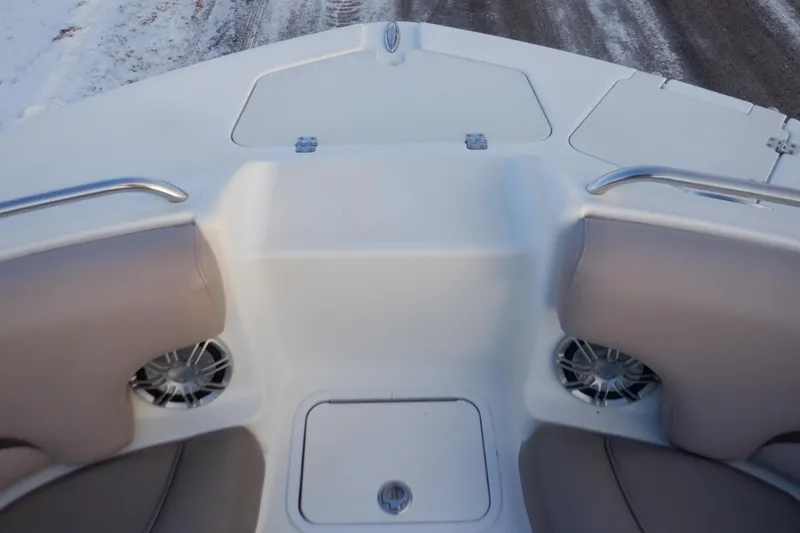 Slide: The Image of 2013 Hurricane SunDeck 2400 IO boat interior with seating and speakers. - 43