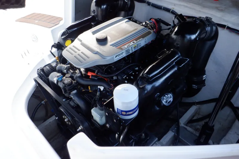 Slide: The Image of 2013 Hurricane SunDeck 2400 IO engine compartment, showcasing a powerful inboard motor. - 48