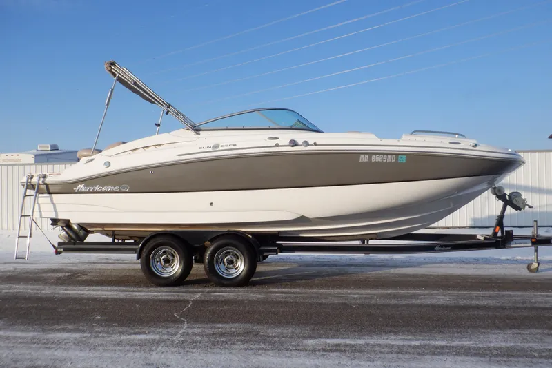 Slide: The Image of 2013 Hurricane SunDeck 2400 IO boat on trailer, side view. - 6