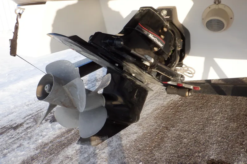 Slide: The Image of 2013 Hurricane SunDeck 2400 IO boat propeller and outdrive close-up. - 8