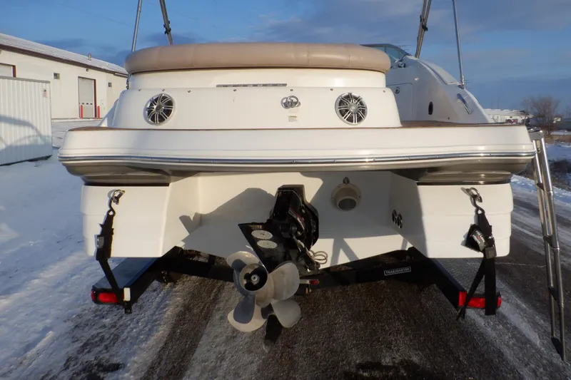 Slide: The Image of 2013 Hurricane SunDeck 2400 IO boat rear view with propeller and speakers. - 9