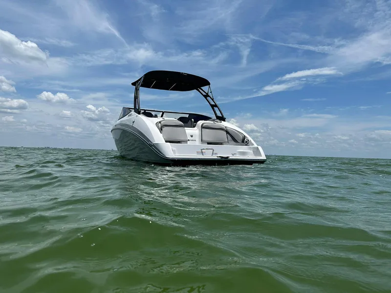 Slide: The Image of 2020 Yamaha AR240 boat on open water under a clear blue sky. - 4