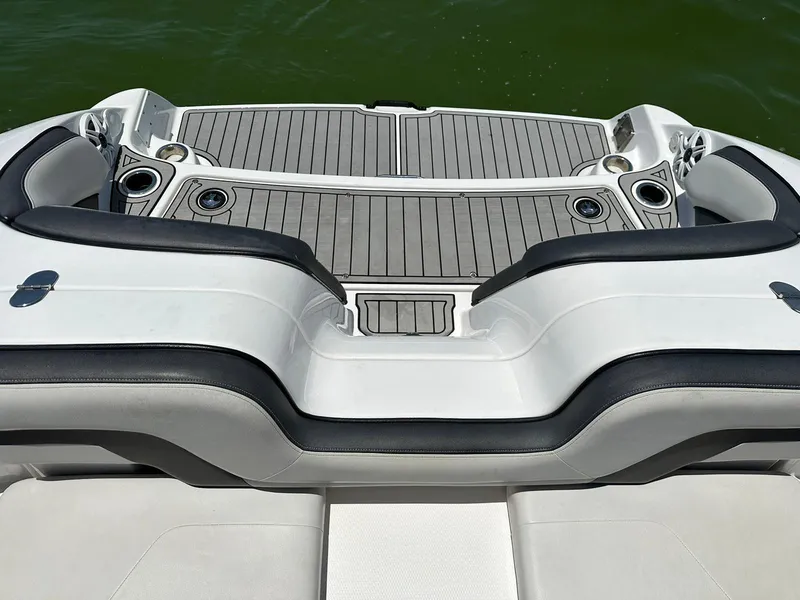 Slide: The Image of 2020 Yamaha AR240 boat swim platform with cushioned seating and cup holders. - 7