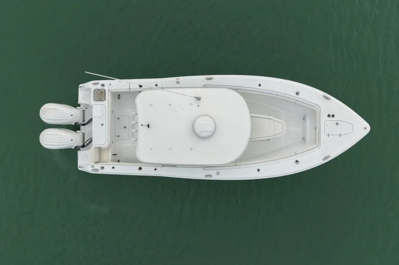 Slide: The Image of 2024 Sea Hunt Gamefish 27 Coffin Box boat, aerial view on water. - 5