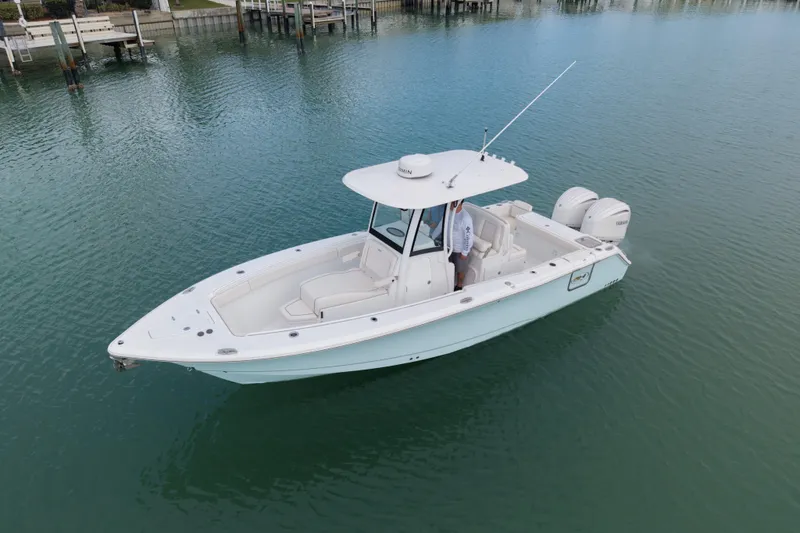 Slide: The Image of 2024 Sea Hunt Gamefish 27 Coffin Box boat on calm water. - 6