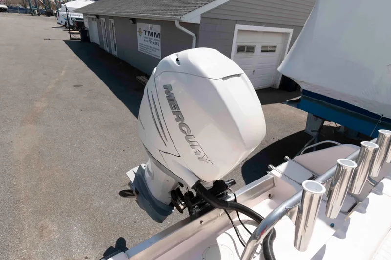 Slide: The Image of 1996 Grady-White Islander 268 boat docked, showcasing bow and deck area. - 12