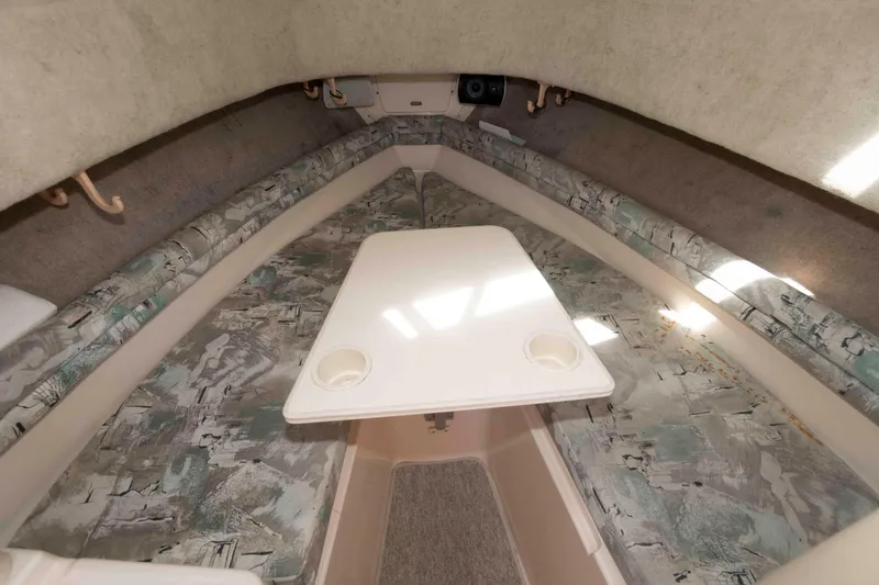 Slide: The Image of 1996 Grady-White Islander 268 cabin interior with kitchenette and seating area. - 14