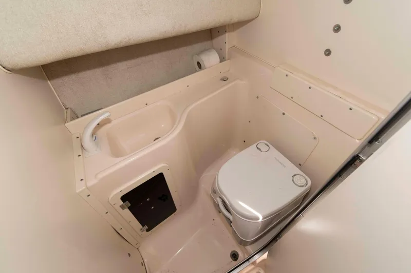 Slide: The Image of Interior cabin of 1996 Grady-White Islander 268 boat with seating and table. - 15