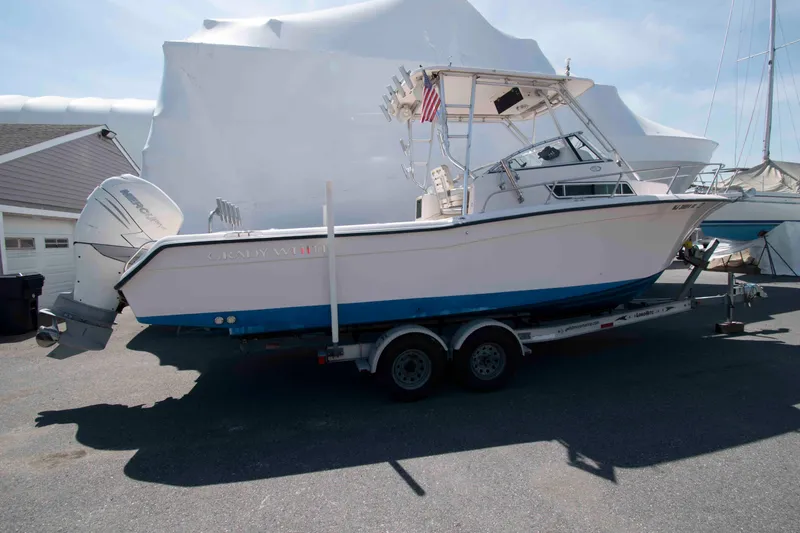 Slide: The Image of 1996 Grady-White Islander 268 boat on trailer, parked outdoors. - 2