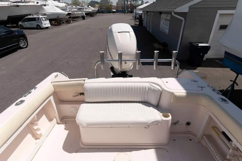 Slide: The Image of 1996 Grady-White Islander 268 boat with outboard motor, parked on a trailer. - 4