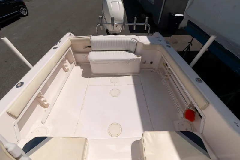 Slide: The Image of 1996 Grady-White Islander 268 boat interior with seating and storage compartments. - 6