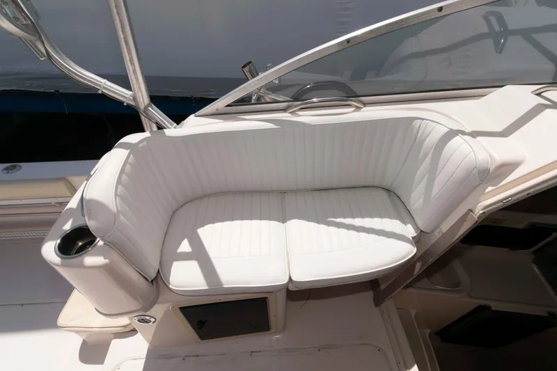 Slide: The Image of 1996 Grady-White Islander 268 boat cockpit with steering wheel and gauges. - 9