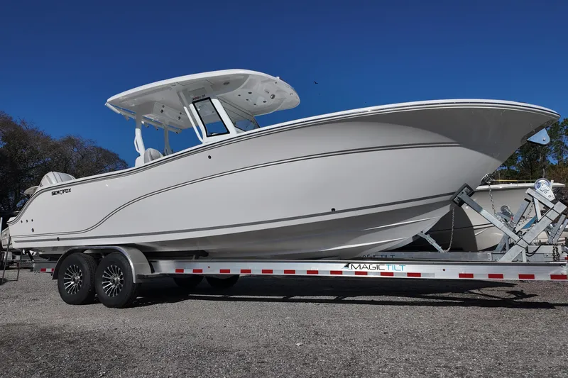 The Image of 2026 Sea Fox 288 Commander boat on trailer under clear blue sky. - 0
