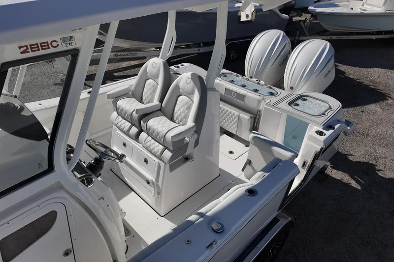 Slide: The Image of 2026 Sea Fox 288 Commander boat interior with dual seats and twin engines. - 10