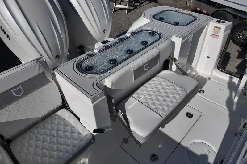 Slide: The Image of 2026 Sea Fox 288 Commander boat interior with seating and storage compartments. - 13