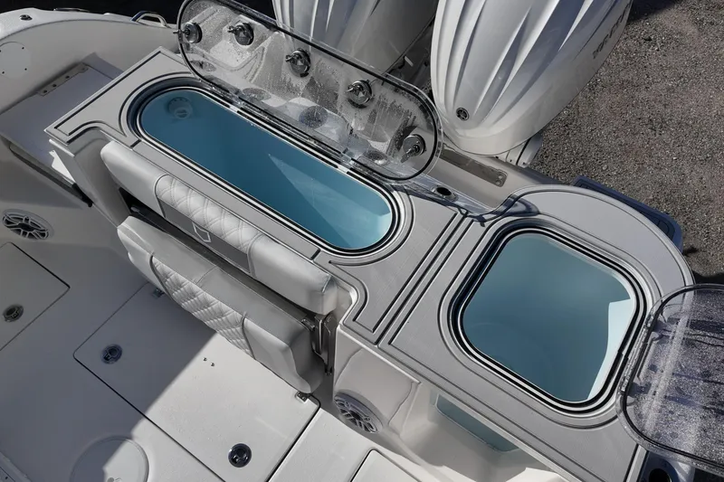 Slide: The Image of 2026 Sea Fox 288 Commander boat interior with open storage compartments and seating. - 14