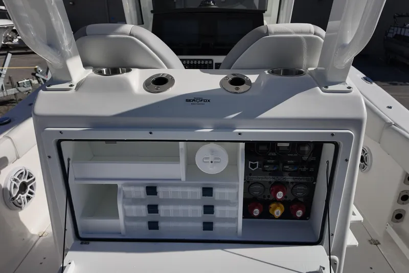 Slide: The Image of 2026 Sea Fox 288 Commander boat console with storage compartments and control panel. - 15