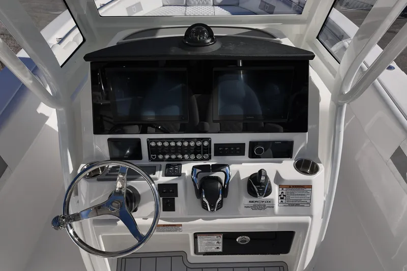 Slide: The Image of 2026 Sea Fox 288 Commander helm with dual screens and modern controls. - 16