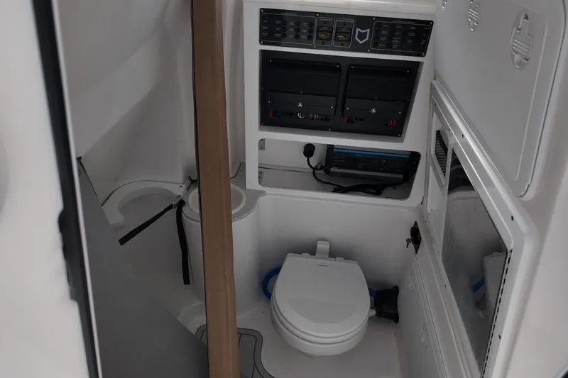 Slide: The Image of 2026 Sea Fox 288 Commander boat interior with toilet and control panels. - 19
