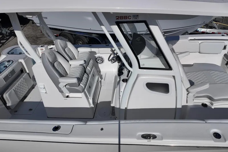 Slide: The Image of 2026 Sea Fox 288 Commander boat interior with modern seating and steering console. - 24