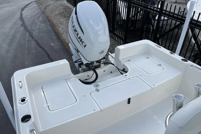 Slide: The Image of 2025 Bulls Bay 2400 boat with Suzuki outboard motor, rear deck view. - 15
