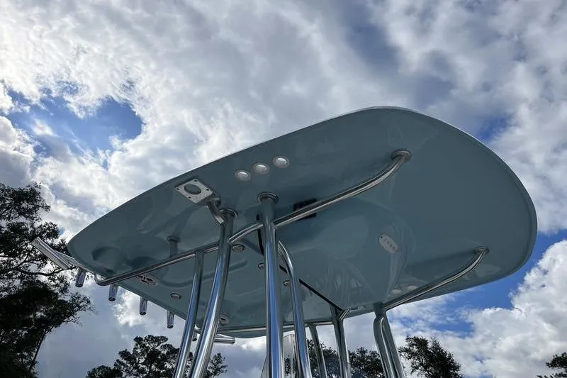 Slide: The Image of T-top of 2025 Bulls Bay 2400 boat against a cloudy sky background. - 18