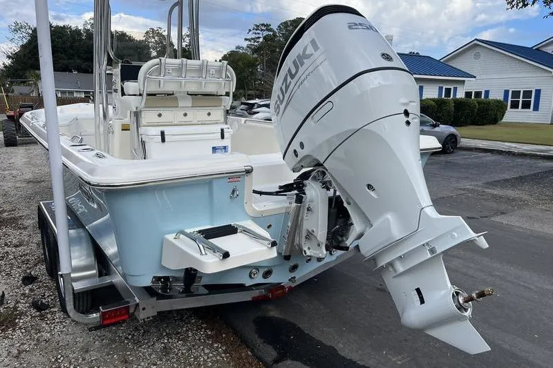Slide: The Image of 2025 Bulls Bay 2400 boat with Suzuki outboard motor on a trailer. - 5