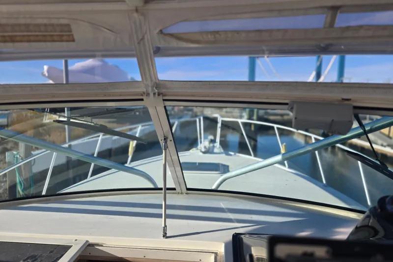 Slide: The Image of 2001 Henriques 35 Flybridge boat view from cockpit, docked in marina. - 4