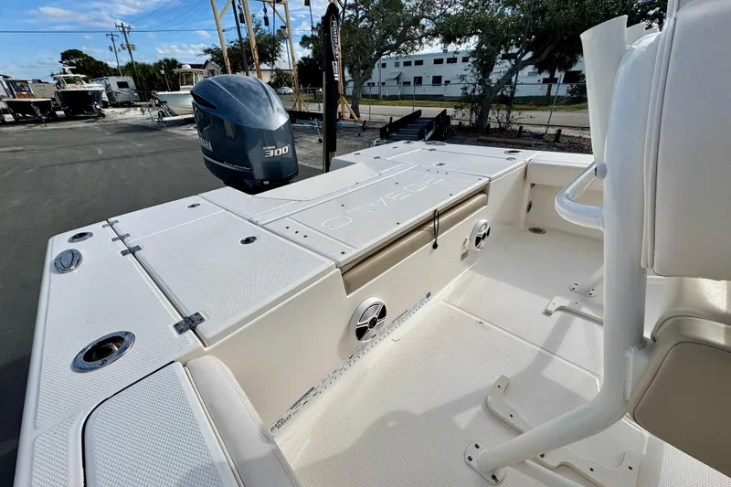 Slide: The Image of 2017 Robalo 246 Cayman boat with Yamaha 300 engine, docked outdoors. - 10