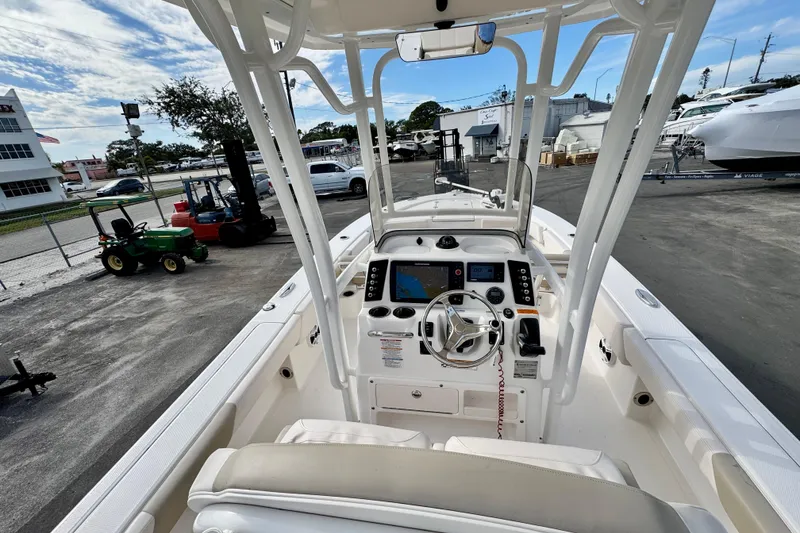Slide: The Image of 2017 Robalo 246 Cayman boat cockpit with steering wheel and navigation system. - 13