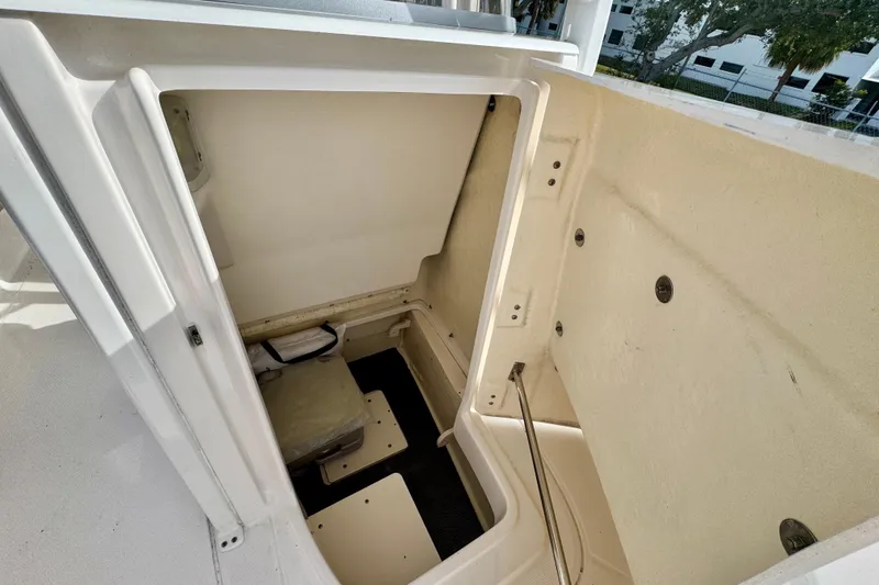 Slide: The Image of 2017 Robalo 246 Cayman boat storage compartment interior view. - 24