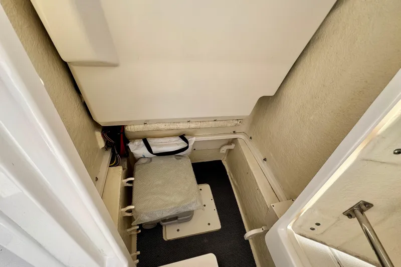 Slide: The Image of Interior view of 2017 Robalo 246 Cayman boat storage compartment. - 25