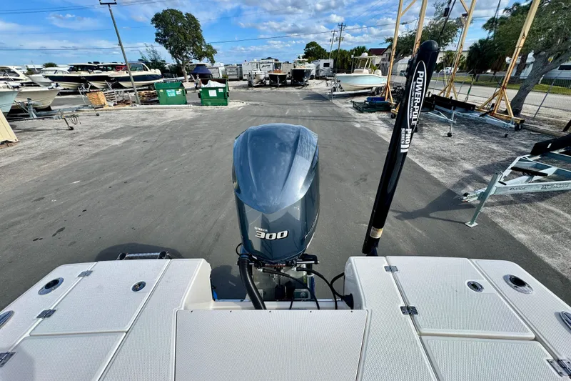 Slide: The Image of 2017 Robalo 246 Cayman boat with Yamaha 300 engine at a marina. - 30