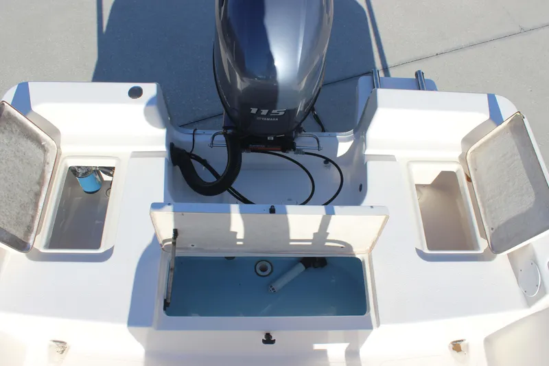Slide: The Image of 2017 Bulls Bay 2000 boat stern with Yamaha 115 engine and open storage compartments. - 11
