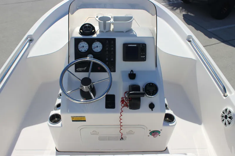 Slide: The Image of 2017 Bulls Bay 2000 boat console with steering wheel and navigation instruments. - 4