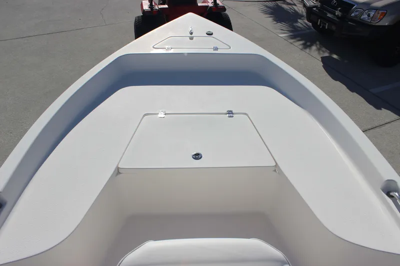 Slide: The Image of 2017 Bulls Bay 2000 boat interior with storage compartment, parked on concrete. - 7